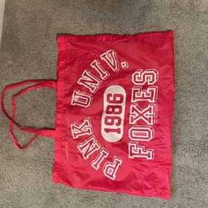 Pink Victoria’s Secret bag.